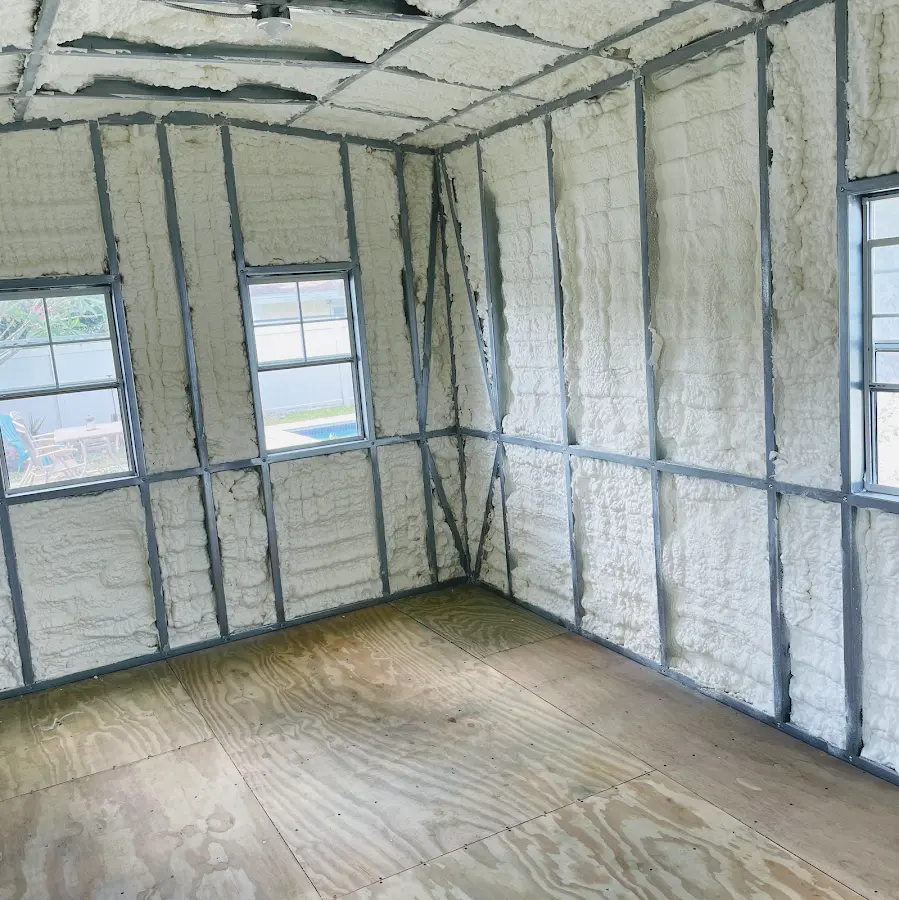 Closed-cell spray foam insulation applied to wall cavities in a residential project in Rahway